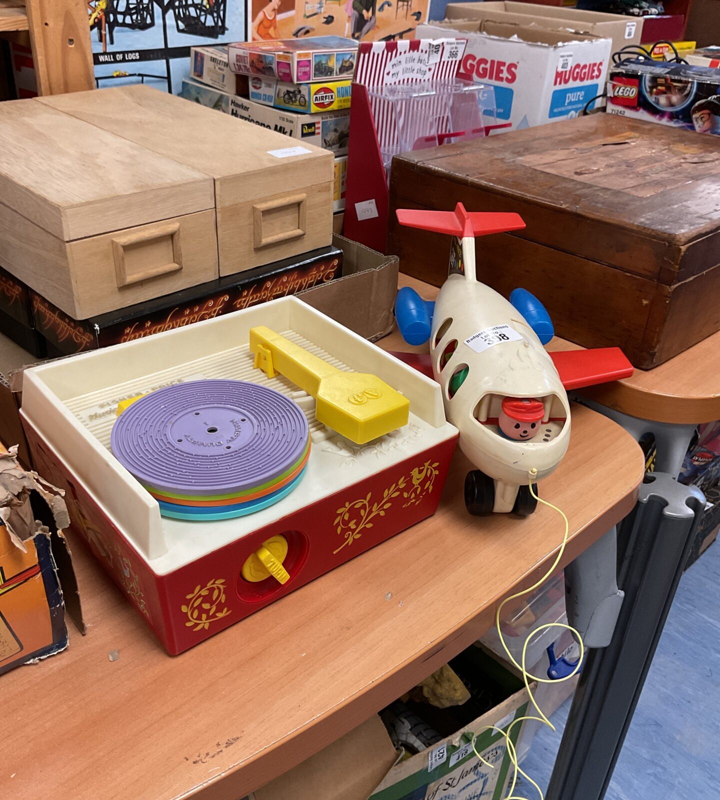 Vintage Fisher Price record player in bright primary colours.