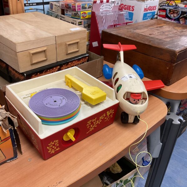 Vintage Fisher Price record player in bright primary colours.