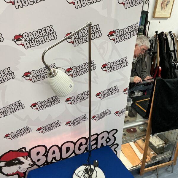 Vintage adjustable floor lamp with a classic mid-century design.