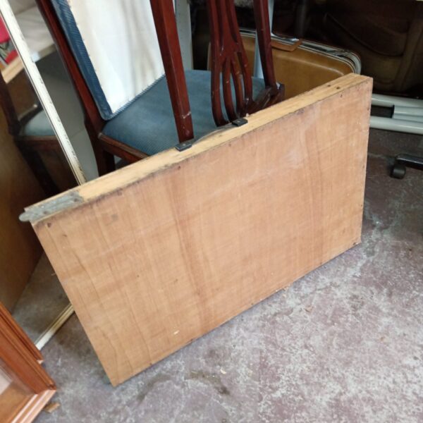 Vintage folding pasting table showing wear and tear.