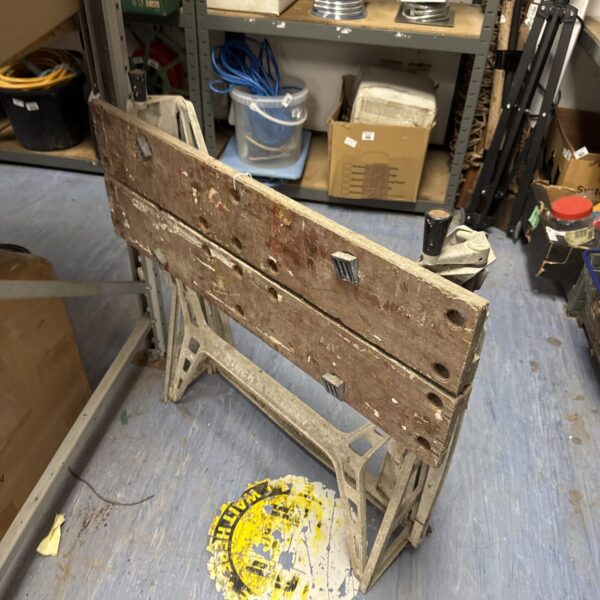 Vintage folding metal workbench, ideal for workshop or DIY projects.