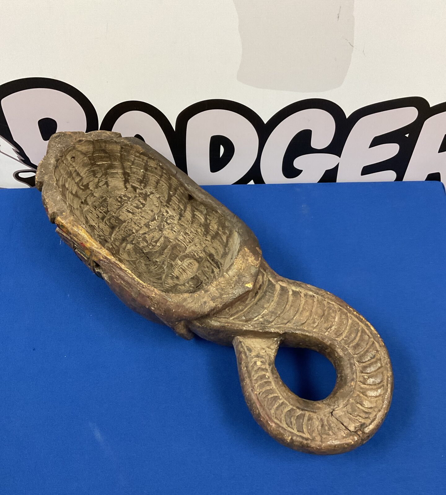 Side view of vintage carved wooden Ganesh mask.