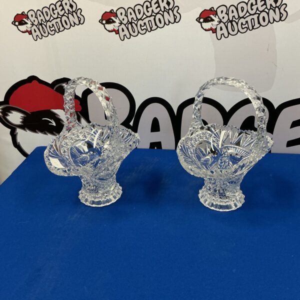 Two vintage glass flower baskets with floral detailing.