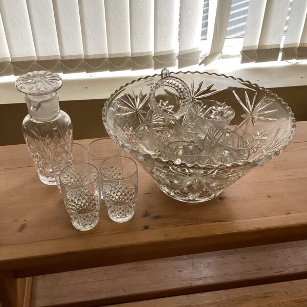 Vintage glass punch bowl set with cocktail shaker and glasses.