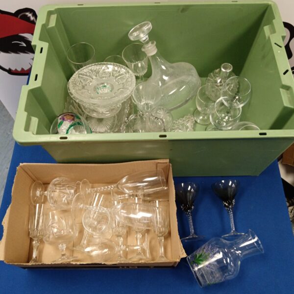 Assorted vintage glassware including a decanter and twist stem glasses.