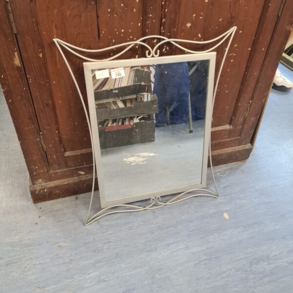 Vintage hall mirror with ornate metal frame, ideal for hallway decor.