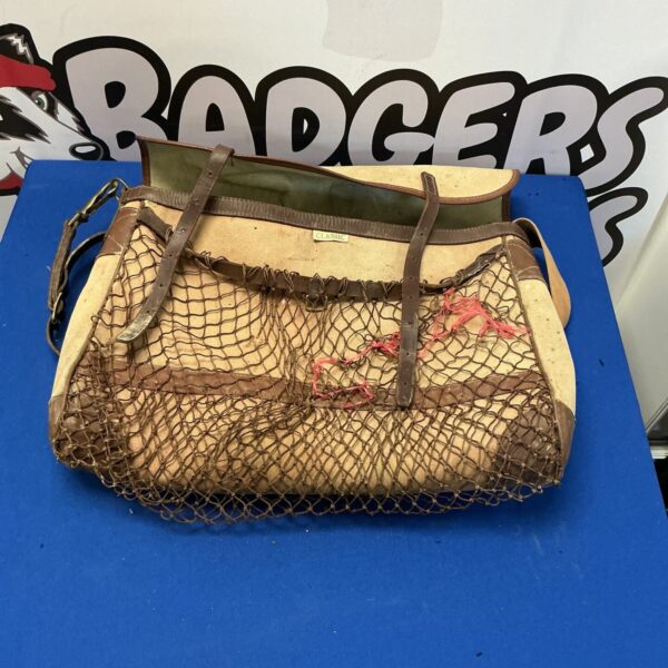 Vintage hunting game bag with woven mesh and leather strap.