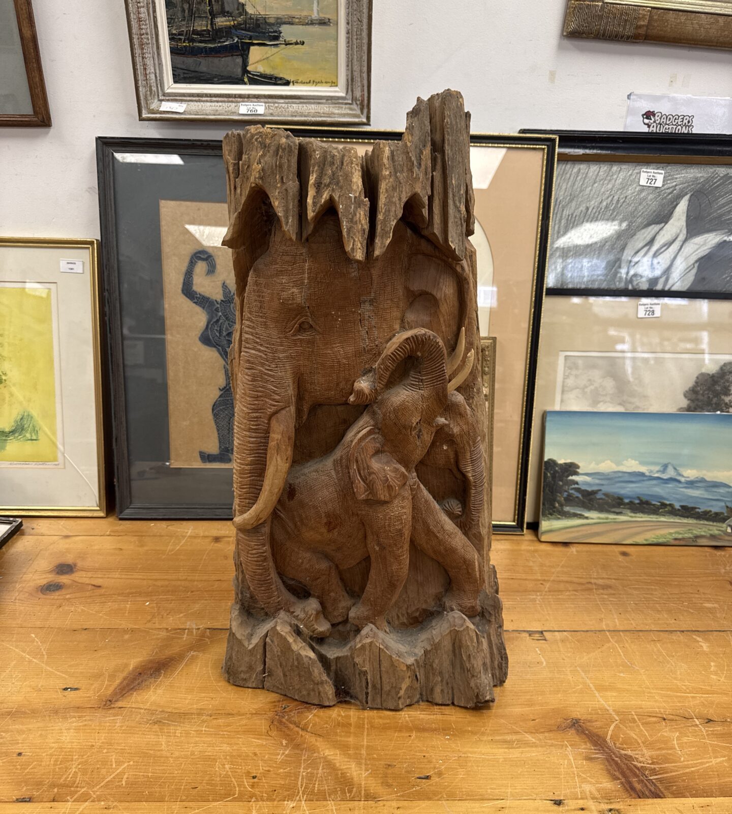 Vintage Indian wooden elephant carving, detailed folk art sculpture.