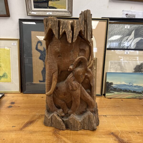Vintage Indian wooden elephant carving, detailed folk art sculpture.