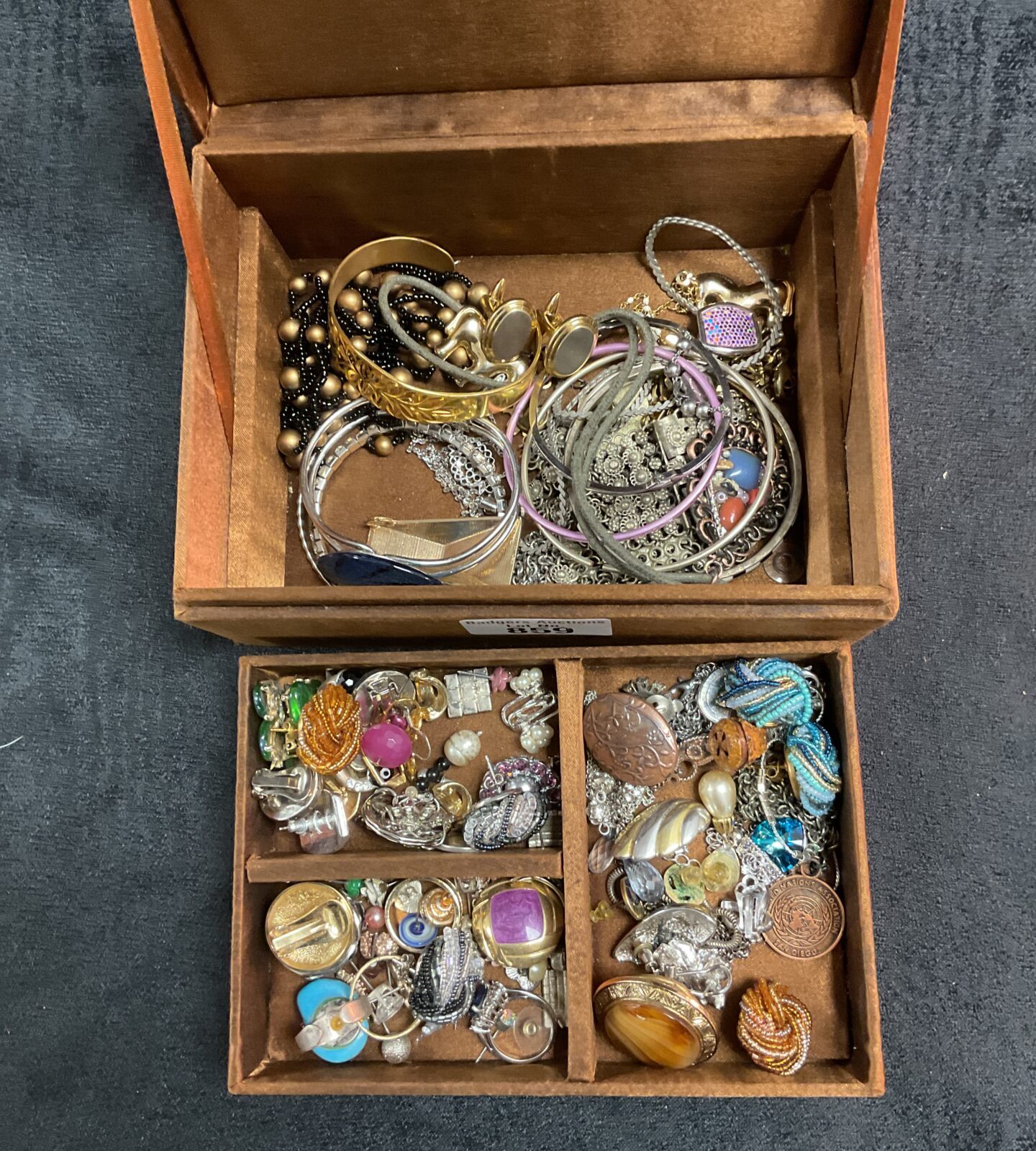Vintage jewellery lot inside a decorative copper box.