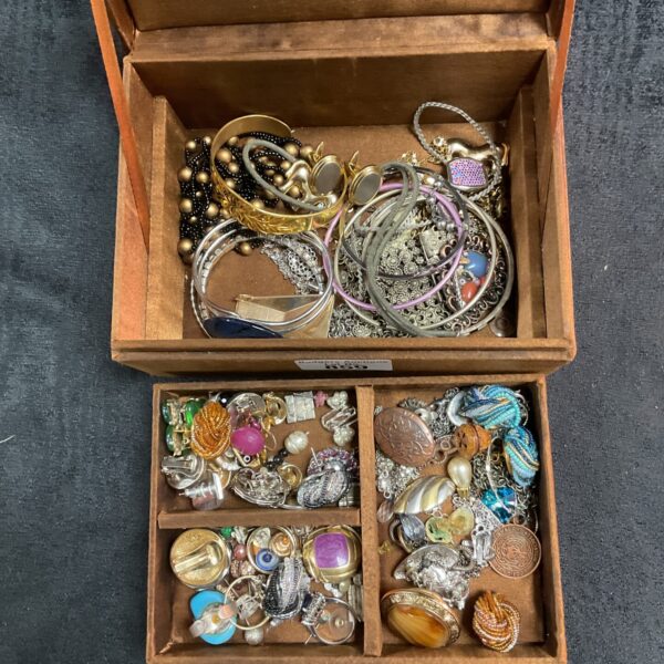Vintage jewellery lot inside a decorative copper box.