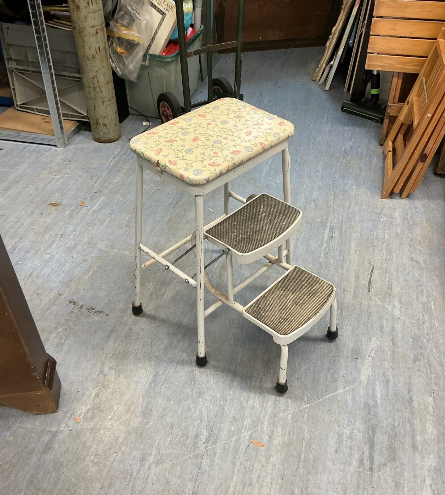 Vintage floral kitchen steps, a retro metal folding stool.