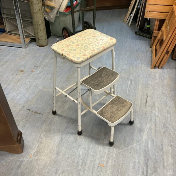 Vintage floral kitchen steps, a retro metal folding stool.