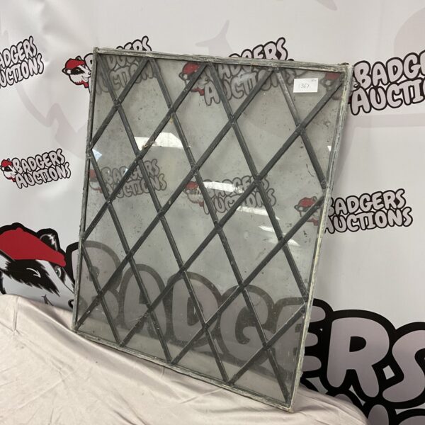 Vintage lead framed glass window with geometric pattern.