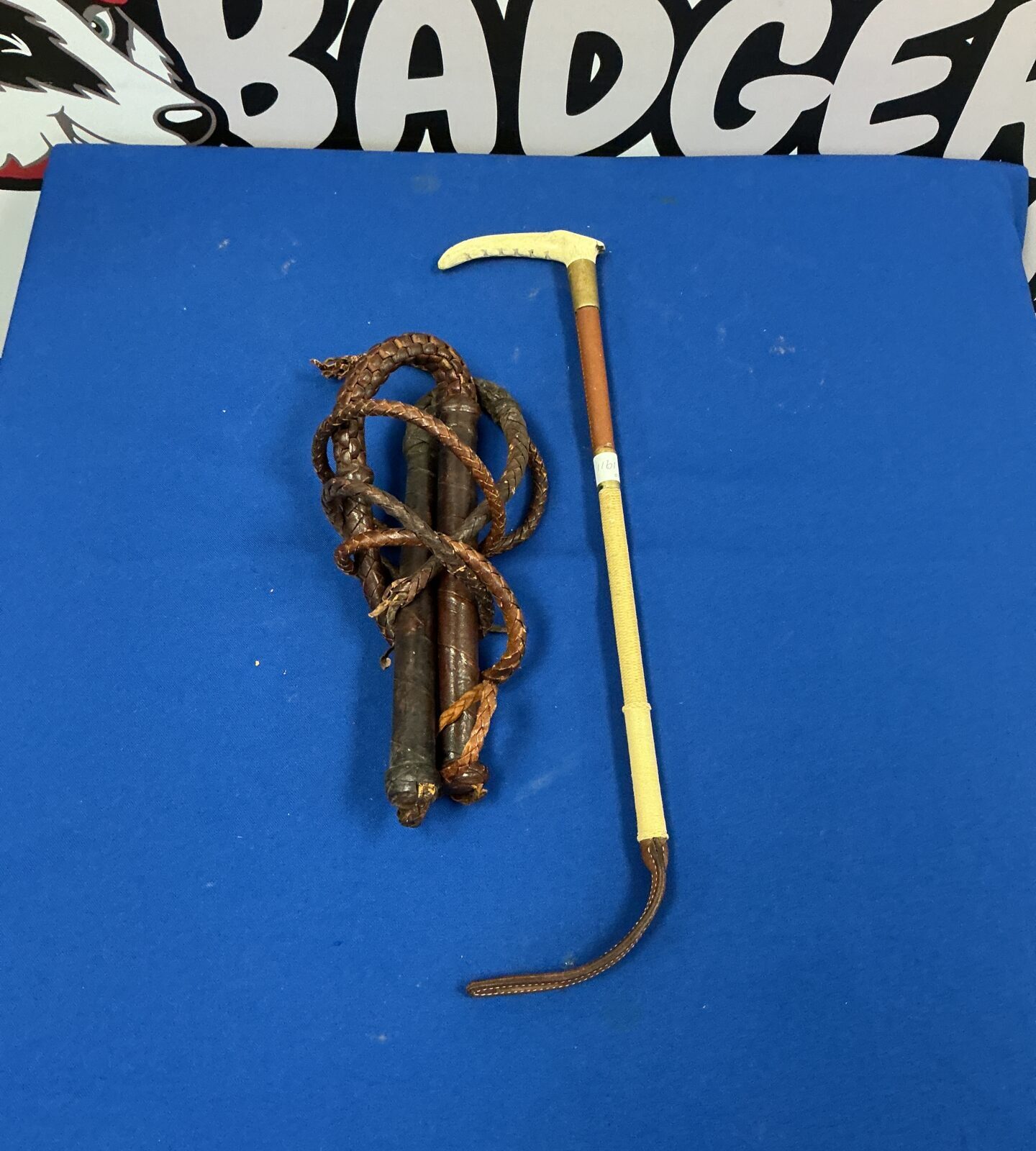 Vintage leather whips and riding crop lot for collectors.