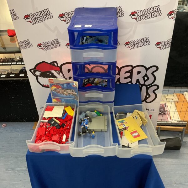 Blue storage case filled with a vintage Lego collection.