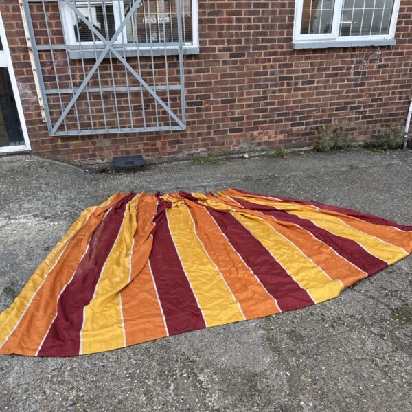 Bold patterned vintage lined curtains in orange and red.
