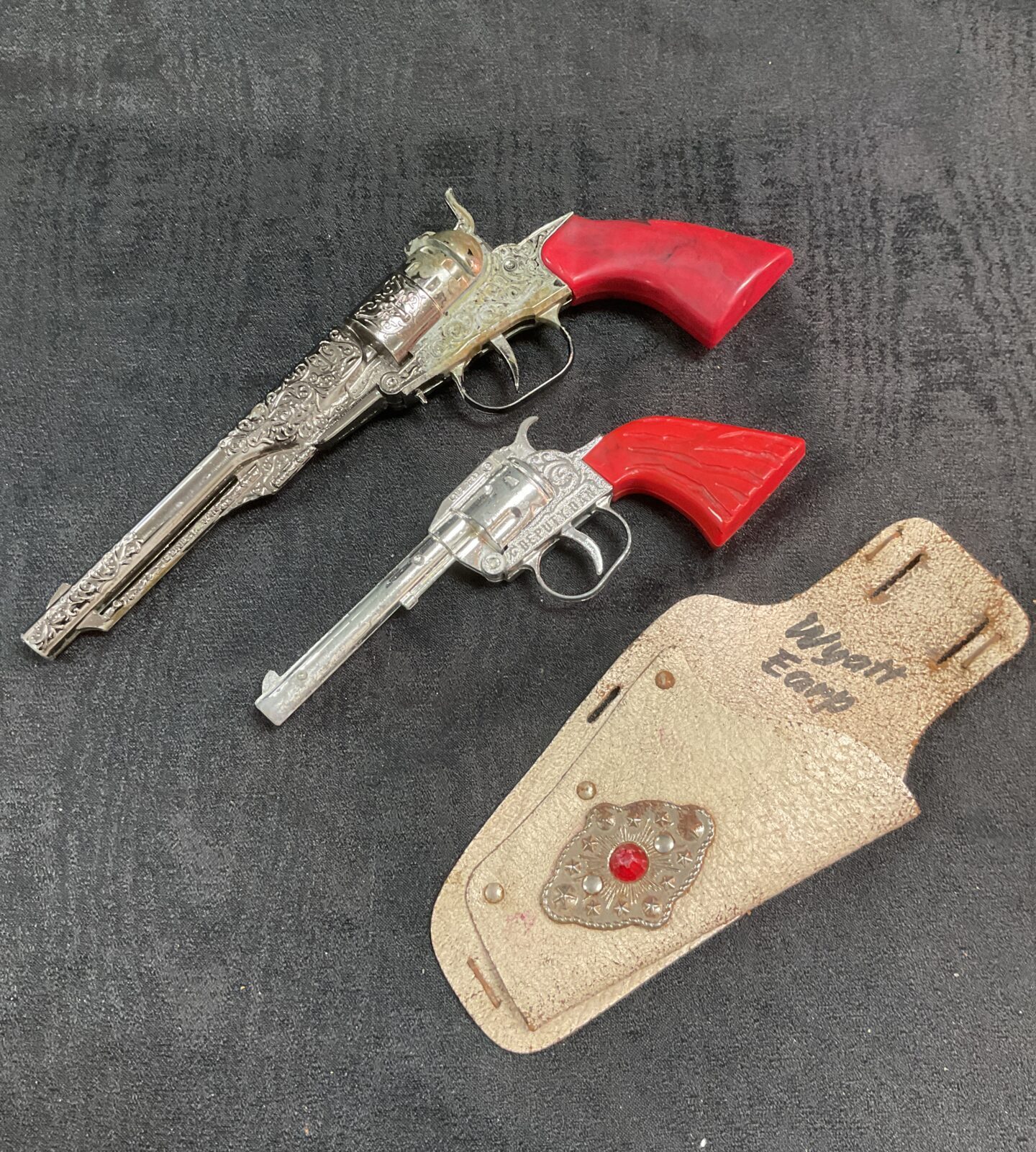 Vintage Lone Star cap guns with Wyatt Earp holster set.