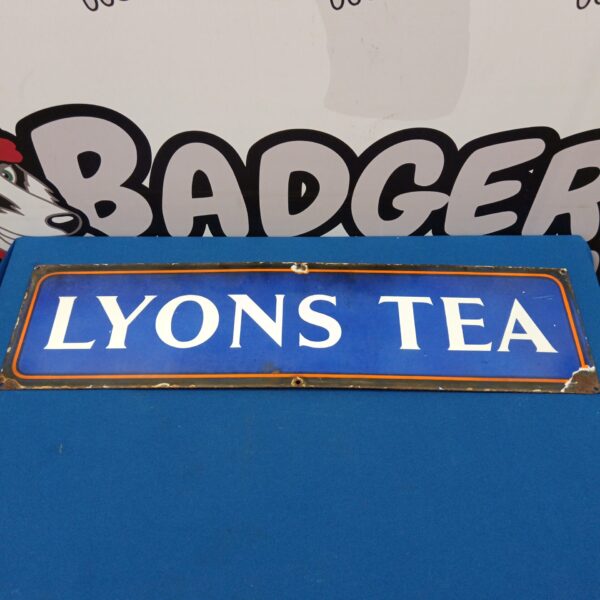 Front view of a vintage Lyons Tea enamel advertising sign.