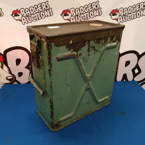 Vintage machine gun ammo tin with signs of wear.