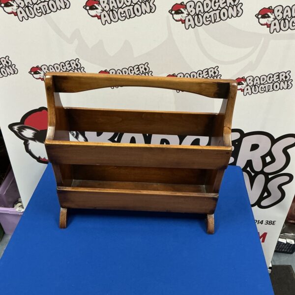 Vintage wooden magazine rack with four compartments.