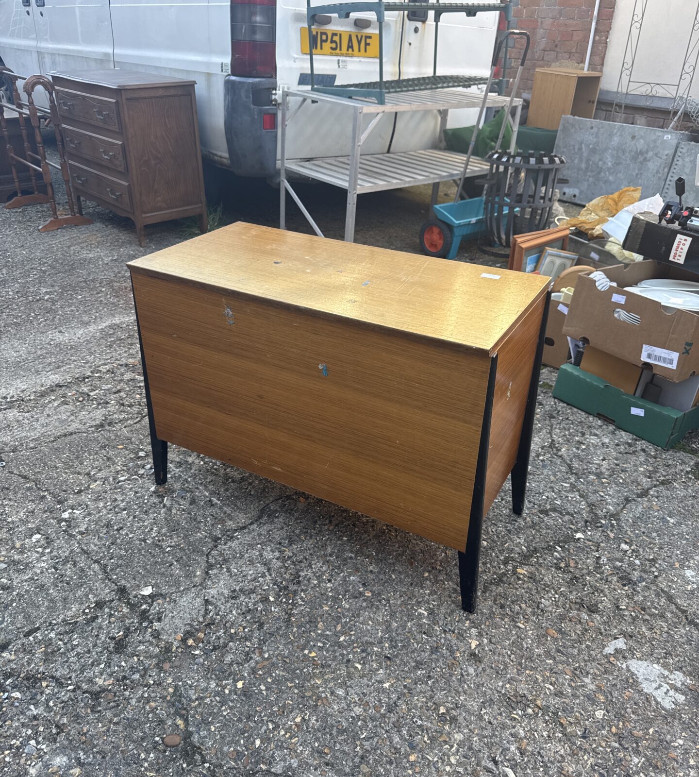 Front view of a vintage mahogany chest of drawers.