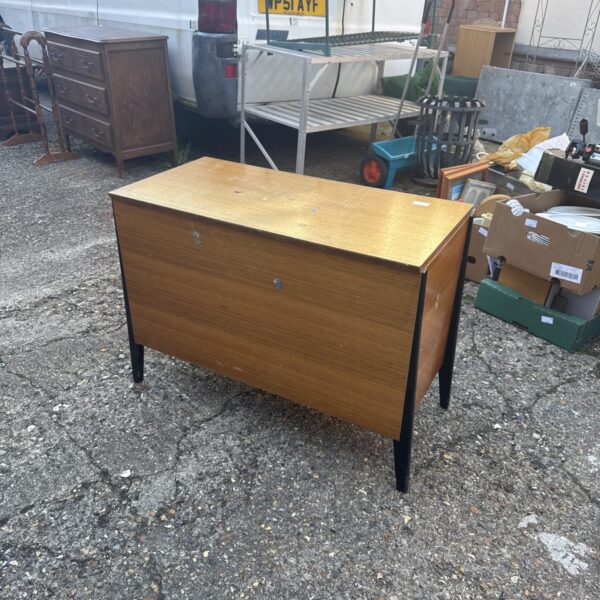 Front view of a vintage mahogany chest of drawers.