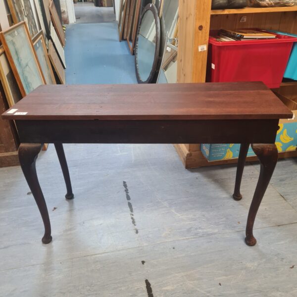 Vintage mahogany console table with curved legs.