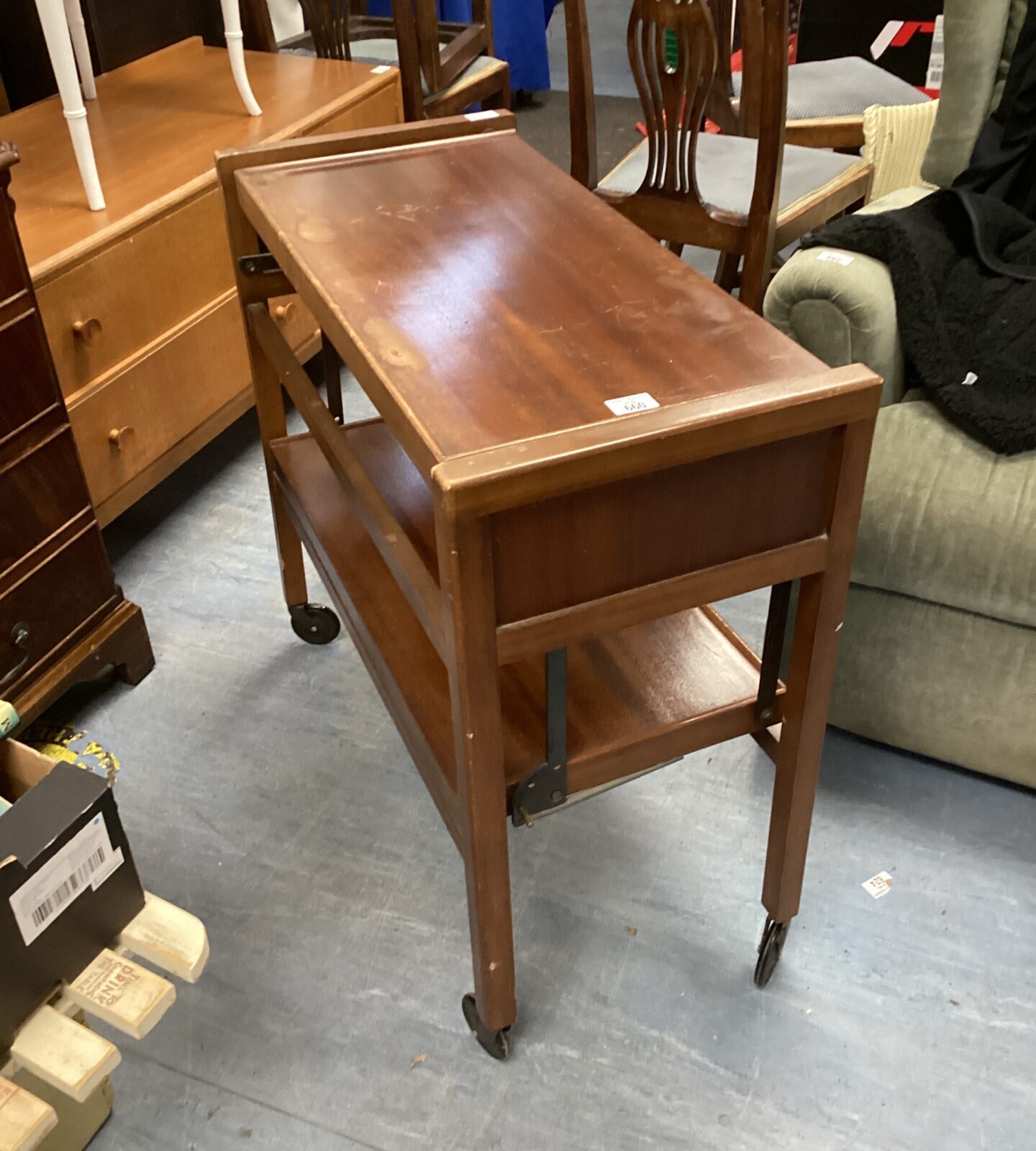 Vintage mahogany serving trolley with a lower shelf.