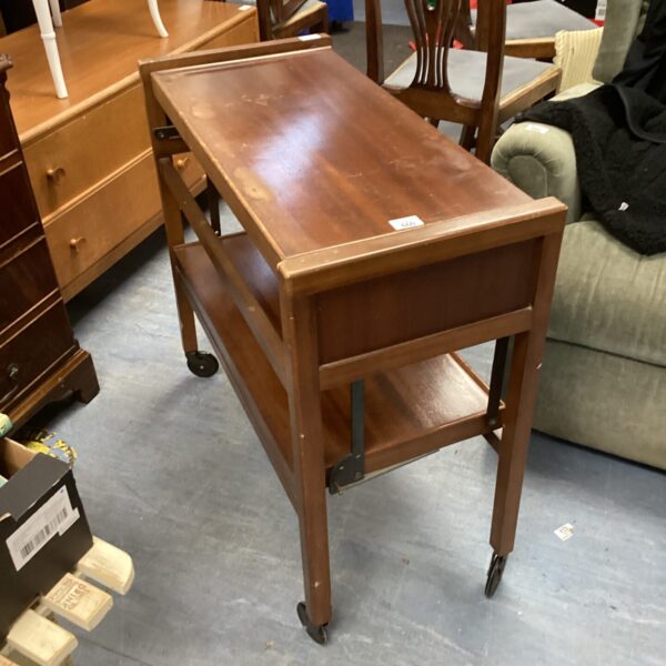 Vintage mahogany serving trolley with a lower shelf.