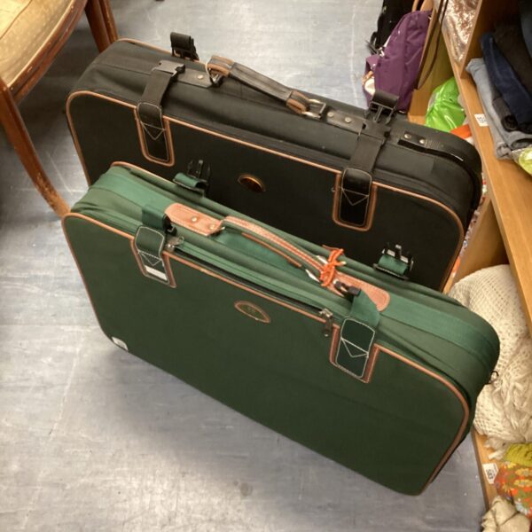 Two vintage green Meridian travel cases stacked together.