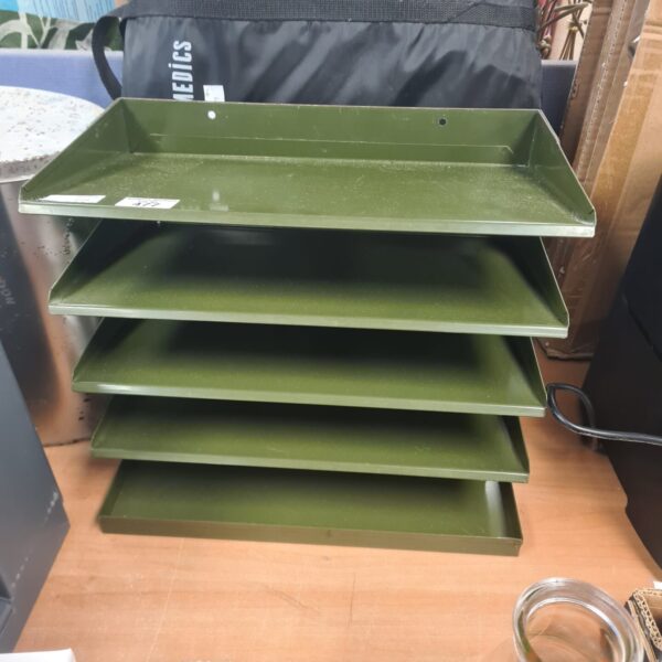 Vintage metal filing unit with four tiers for document storage.