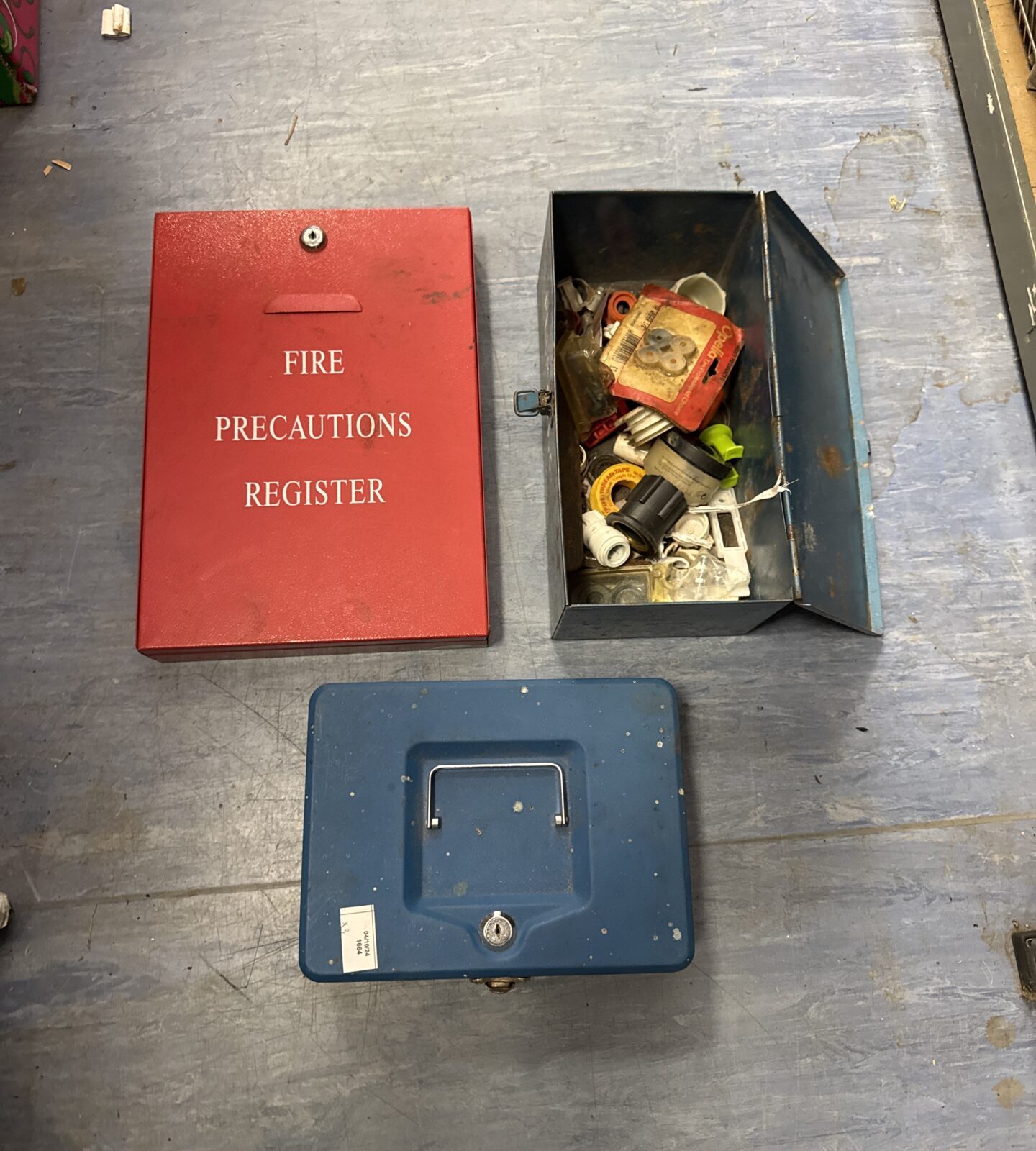 Vintage metal storage tin with documents inside.