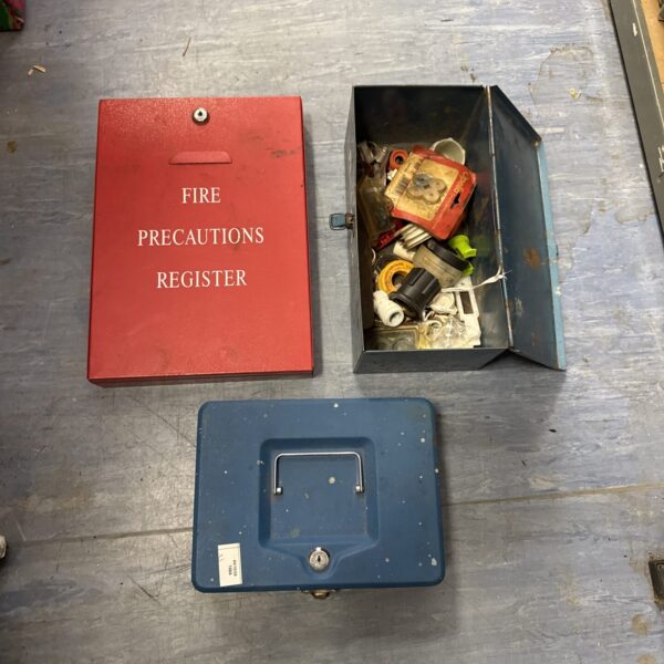 Vintage metal storage tin with documents inside.