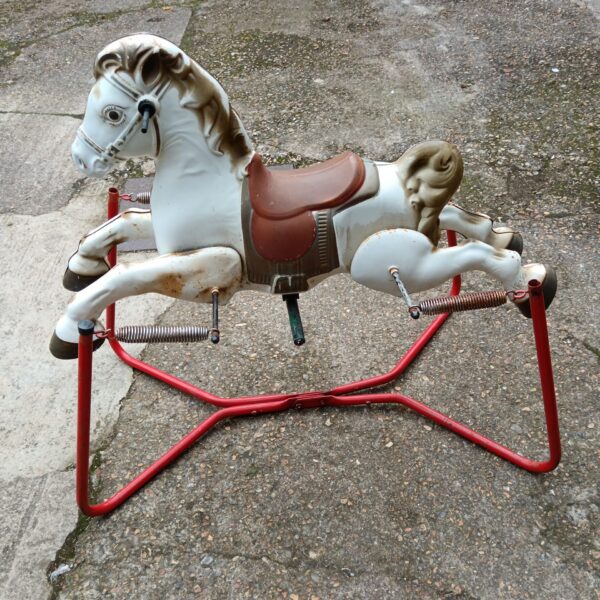 Vintage Mobo rocking horse on springs, a retro children's toy.