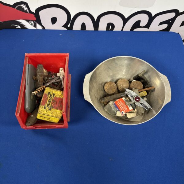 Vintage Morris 8 car badge, classic automotive emblem.