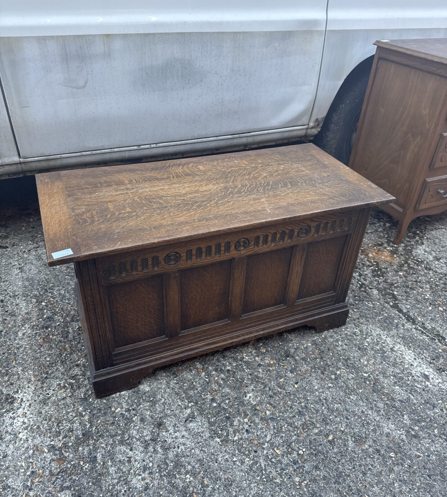 Front view of a vintage oak chest by Hunters of Derby.