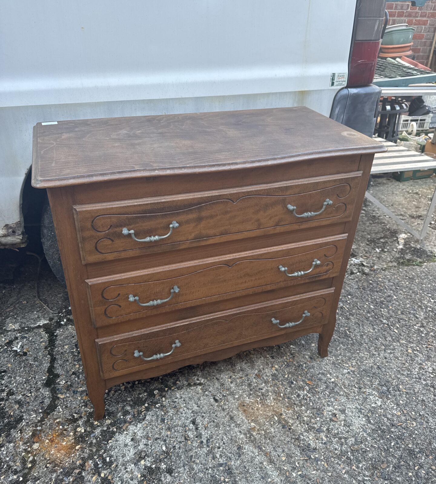 Vintage oak chest of drawers with three drawers, classic storage.