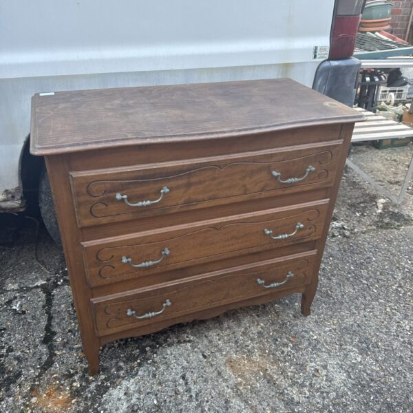 Vintage oak chest of drawers with three drawers, classic storage.