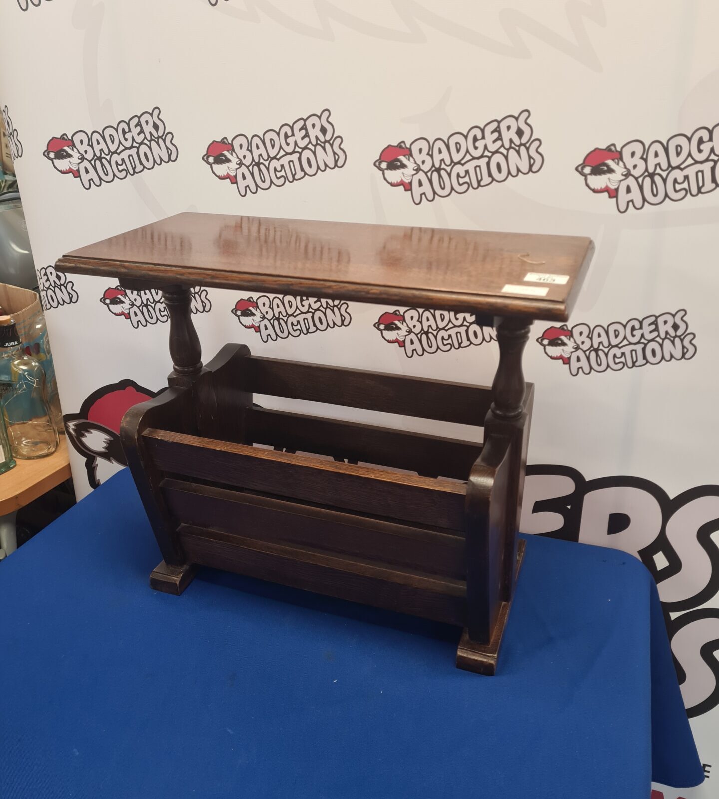 Vintage oak magazine rack side table with slatted design.