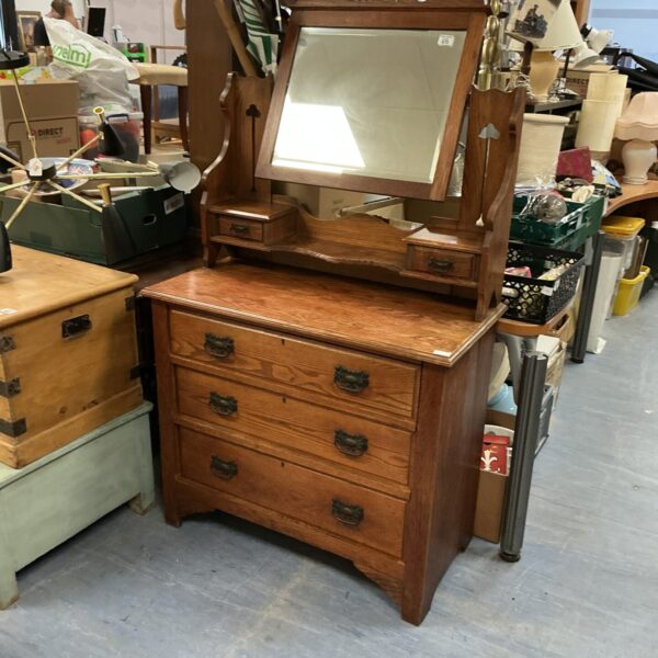 Vintage oak sideboard with a large mirrored back.