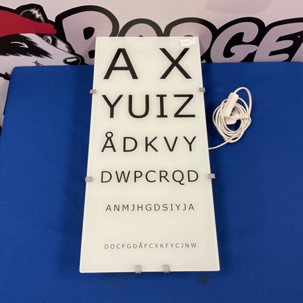 Vintage optician alphabet light box with illuminated letters.