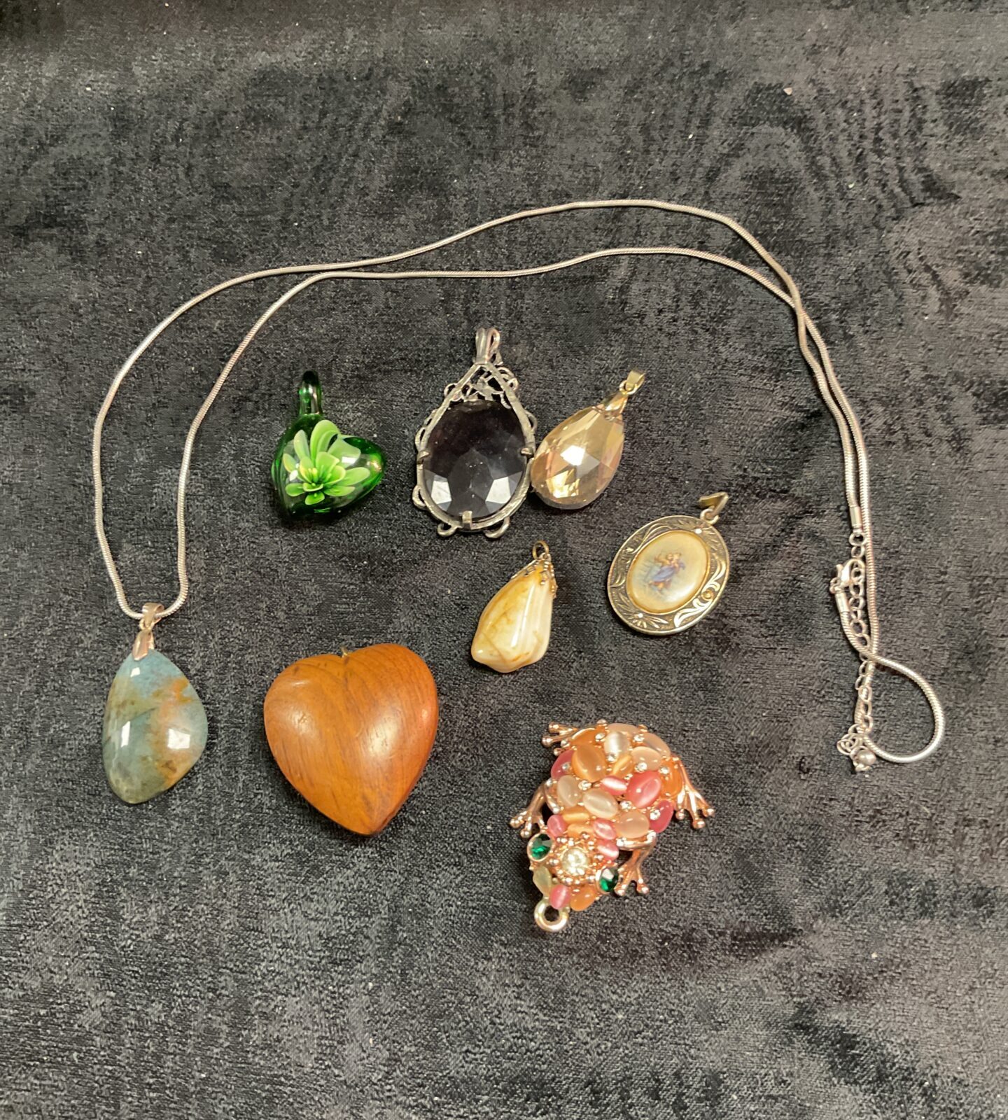 Vintage pendant necklace with eclectic assortment of pendants.