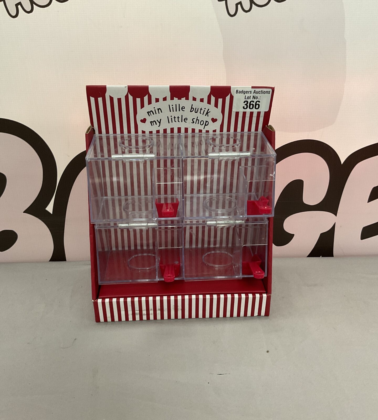 Vintage plastic penny sweet dispenser with multiple tiers.