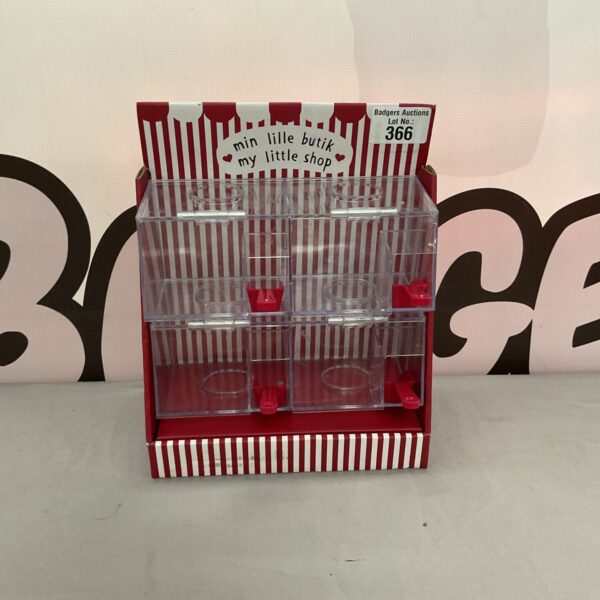 Vintage plastic penny sweet dispenser with multiple tiers.