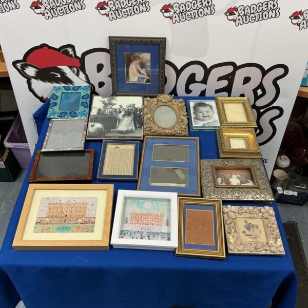 Assorted vintage photo frames in a variety of styles and sizes.