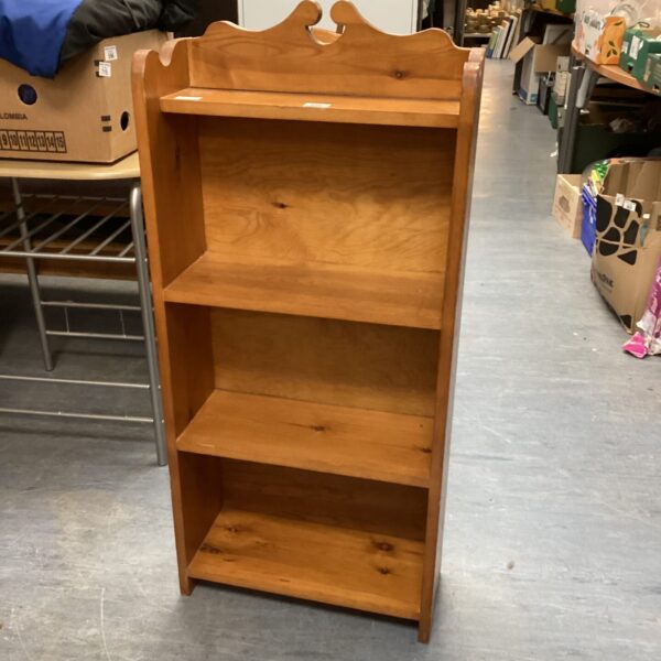 Vintage pine bookshelf with three tiers, ideal for farmhouse decor.