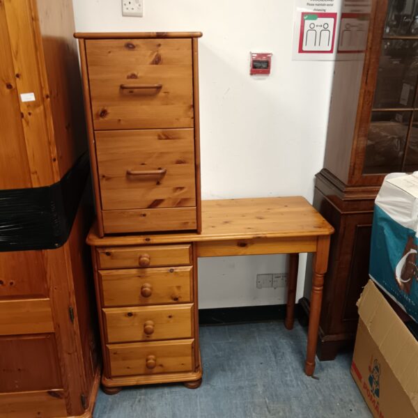 Vintage pine desk with two drawers for home office use.