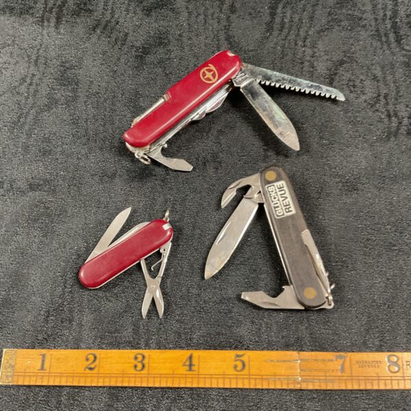 Lot of three vintage folding pocket knives with tools.