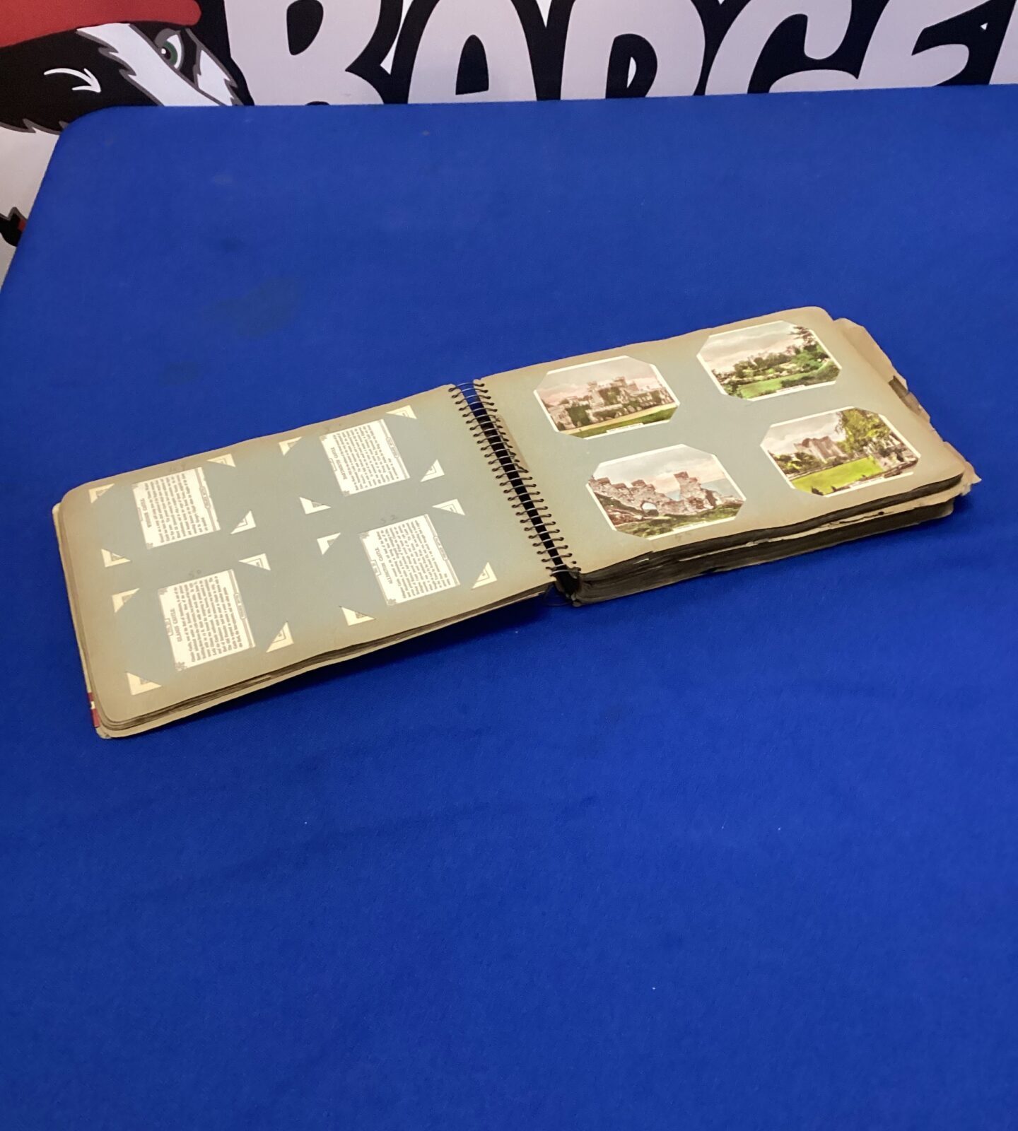 Front view of a vintage postcard ring binder.